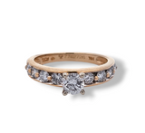 14kt yellow gold round cut diamond engagement ring with round accent diamonds