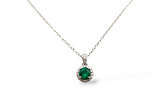 white gold emerald and diamond halo necklace