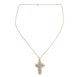 A gold cross pendant necklace adorned with small clear stones, displayed on a delicate gold chain against a light gray background.
